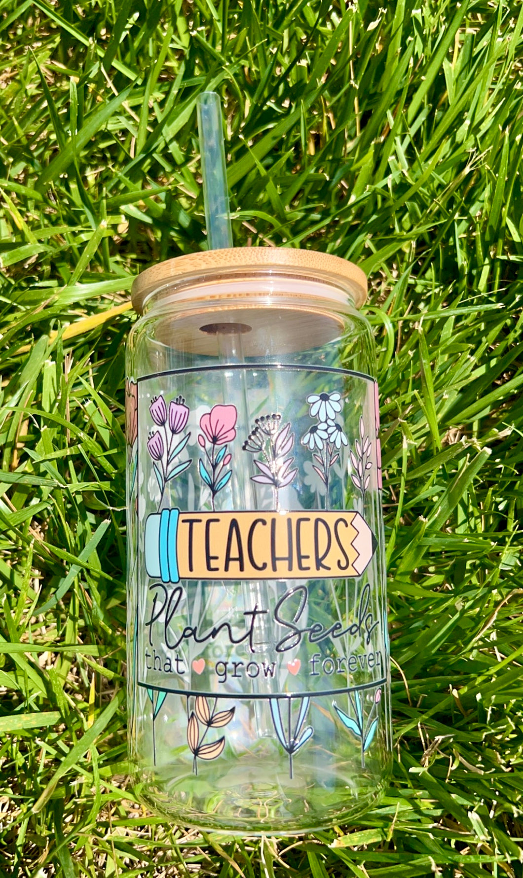 Teachers plant seeds glass can